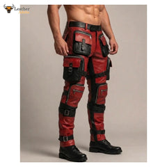 Red and black leather cargo pants with multiple utility pockets and straps, shown on a male model from the waist down against a plain beige studio background.