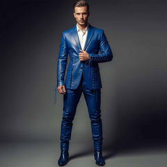 Full length front view of handsome man wearing handmade luxury royal blue leather suit with lace-up blazer and matching slim pants on grey studio background