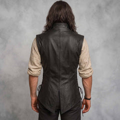 Direct rear view of man wearing tailored black leather renaissance jerkin showing center seam and traditional split peplum hem
