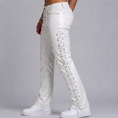 Side profile view showcasing the silver eyelets and full-length crisscross lace-up detail along the outer seam of men's white leather biker pants.