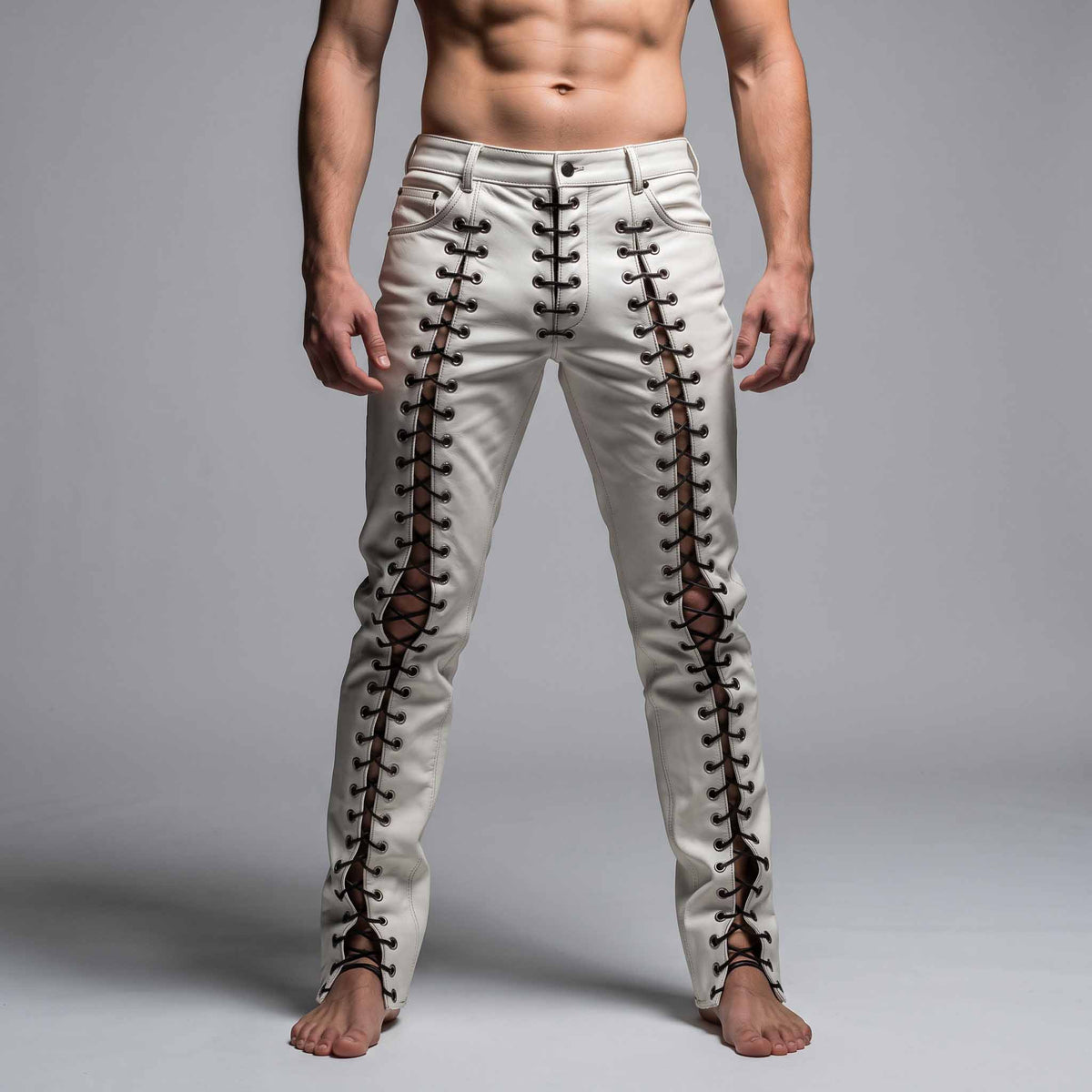 Full length front view of athletic man wearing handmade white genuine cowhide leather lace up pants with black cord eyelet lacing on grey background