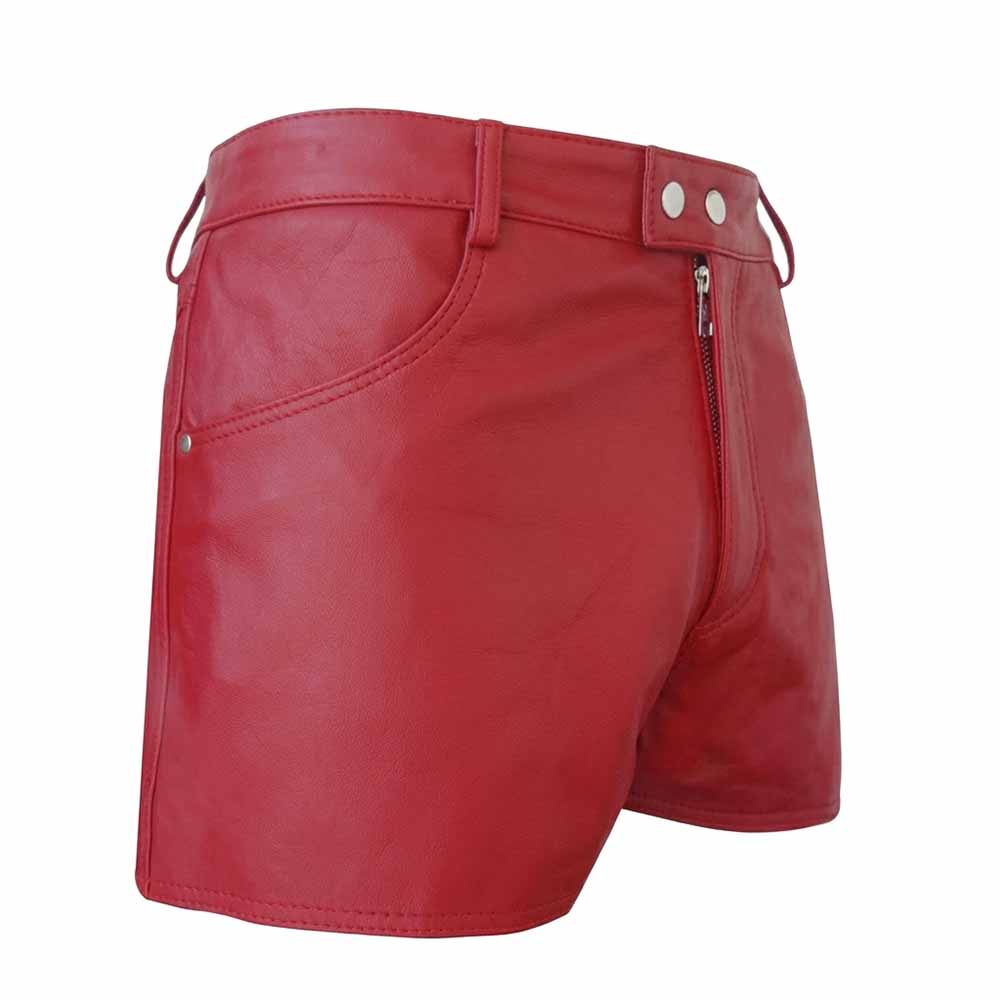 Front three-quarter view of men's short red genuine leather shorts featuring double snap waist closure, YKK zipper fly, and side slash pockets.