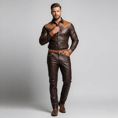 Full length front view of a man wearing a bespoke two-tone dark brown and tan leather shirt and tailored leather pants set