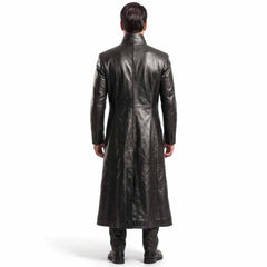 Back view of a man wearing a full length black leather duster coat showing panel craftsmanship
