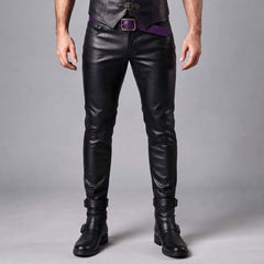 Front view of a man wearing black real leather slim-fit pants paired with a dark purple waist belt and black buckled boots.