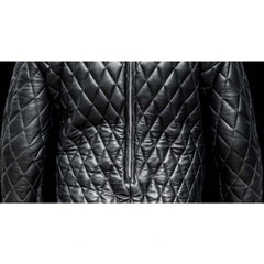 Black quilted jacket with a zipper on a white background
