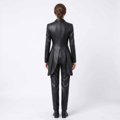 Back view of woman wearing tailored black leather formal tailcoat suit showcasing sculpted spine seams, split equestrian tails, and matching pants