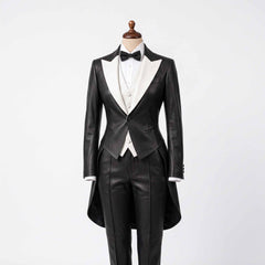Full length studio shot of ladies black genuine leather tuxedo tailcoat suit with contrast white lapels displayed on tailor mannequin