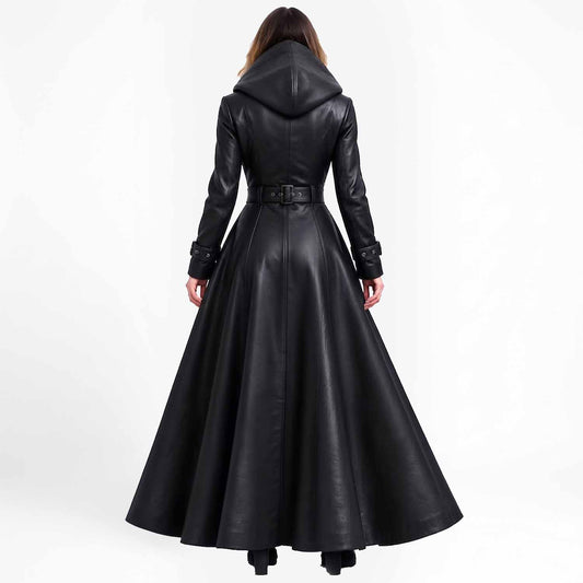 Rear view of a woman showcasing the large hood, structured paneled back seams, and dramatic floor-length drape of the black gothic leather coat.