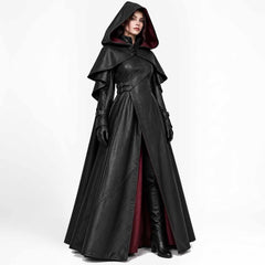 Front view of a woman wearing a black leather hooded cloak with a burgundy inner lining, layered shoulder cape, side buckles, and lace-up neckline.