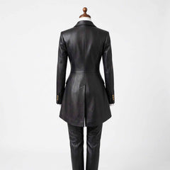 Back view of womens black leather tailcoat showing structured spine seams, long split formal tails, and tapered leather trousers