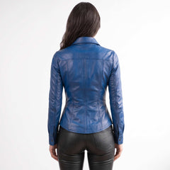 Full back view displaying the ergonomic tailoring, clean seam lines, and waist drape of a women's blue lambskin leather overshirt.