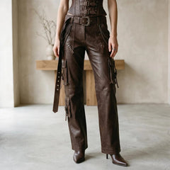 Lower-body close-up view highlighting the functional thigh cargo pockets, leather straps, waist belt buckle, and side chain hardware.