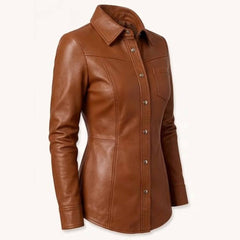 Three quarter front perspective highlighting the spread collar, tailored waistline, and curved hem of a brown genuine leather top.