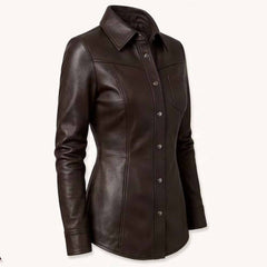Three quarter front perspective highlighting the spread collar, tailored waistline, and curved hem of an espresso brown genuine leather top.