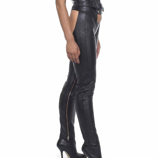 Side profile view of model wearing black soft cowhide leather chaps with exposed inner leg zipper detail and high heels