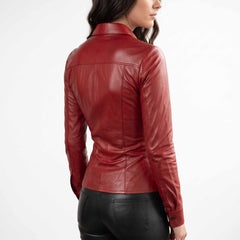 Three quarter rear angle of a model presenting the tailored waist and curved hem of a handcrafted red leather top.