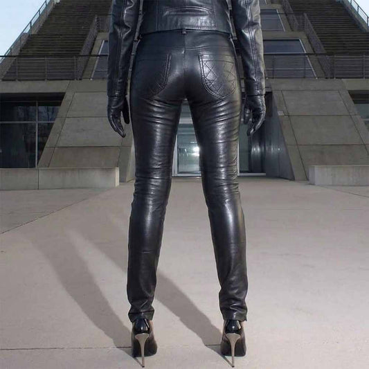 Back view of model wearing black genuine sheep nappa leather leggings featuring diamond-quilted rear pockets and stiletto heels