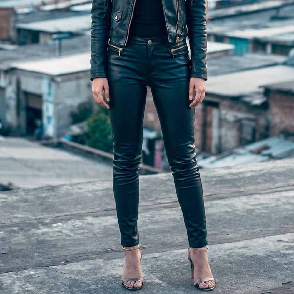 Front view of women's form-fitting black lambskin leather trousers with zip fly and waistband button