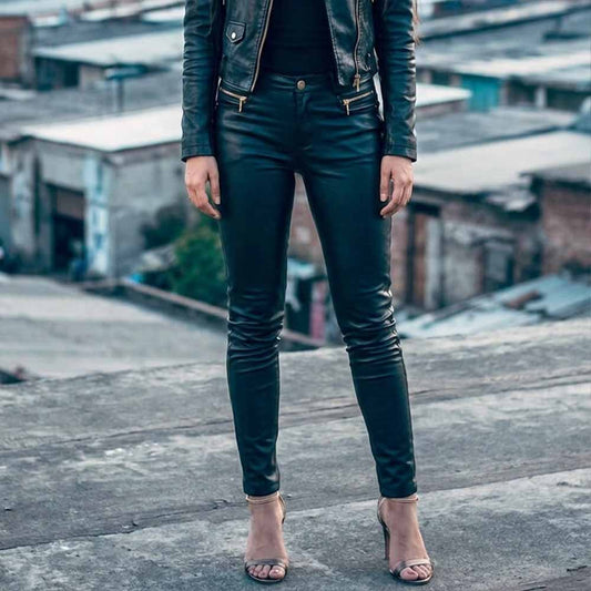 Front view of women's form-fitting black lambskin leather trousers with zip fly and waistband button