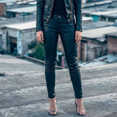 Front view of women's form-fitting black lambskin leather trousers with zip fly and waistband button