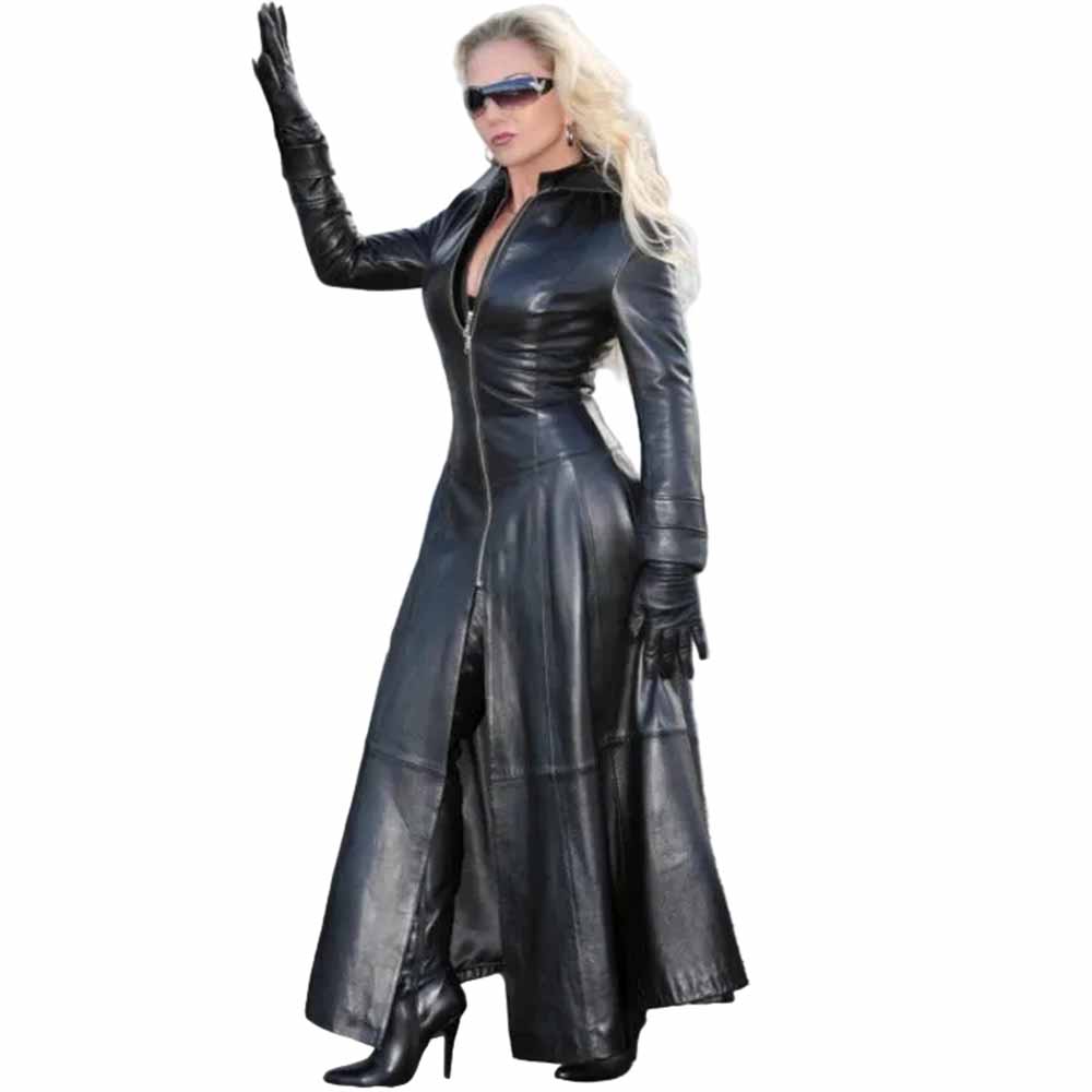 Dynamic side angle of a woman in a full-length black leather Gothic Matrix trench coat styled with high heel boots and sunglasses.