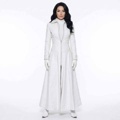 Full length front view of a woman in a white Nappa leather trench coat dress standing in a studio.