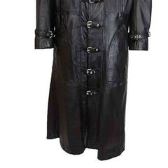 Close-up of silver metal buckle fasteners and double-stitched seams on a men's black real leather duster coat.
