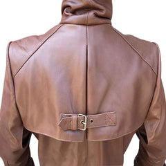 Detailed view of the upper shoulder cape and central buckle closure on the back of a men's brown leather coat.