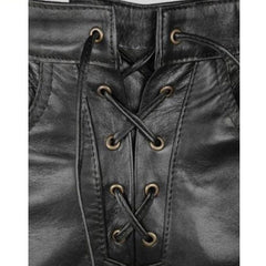 Close-up of a black leather garment with a lace-up front, showing the stitching, eyelets, and laces. A Leather Addict logo is visible in the top-left corner.